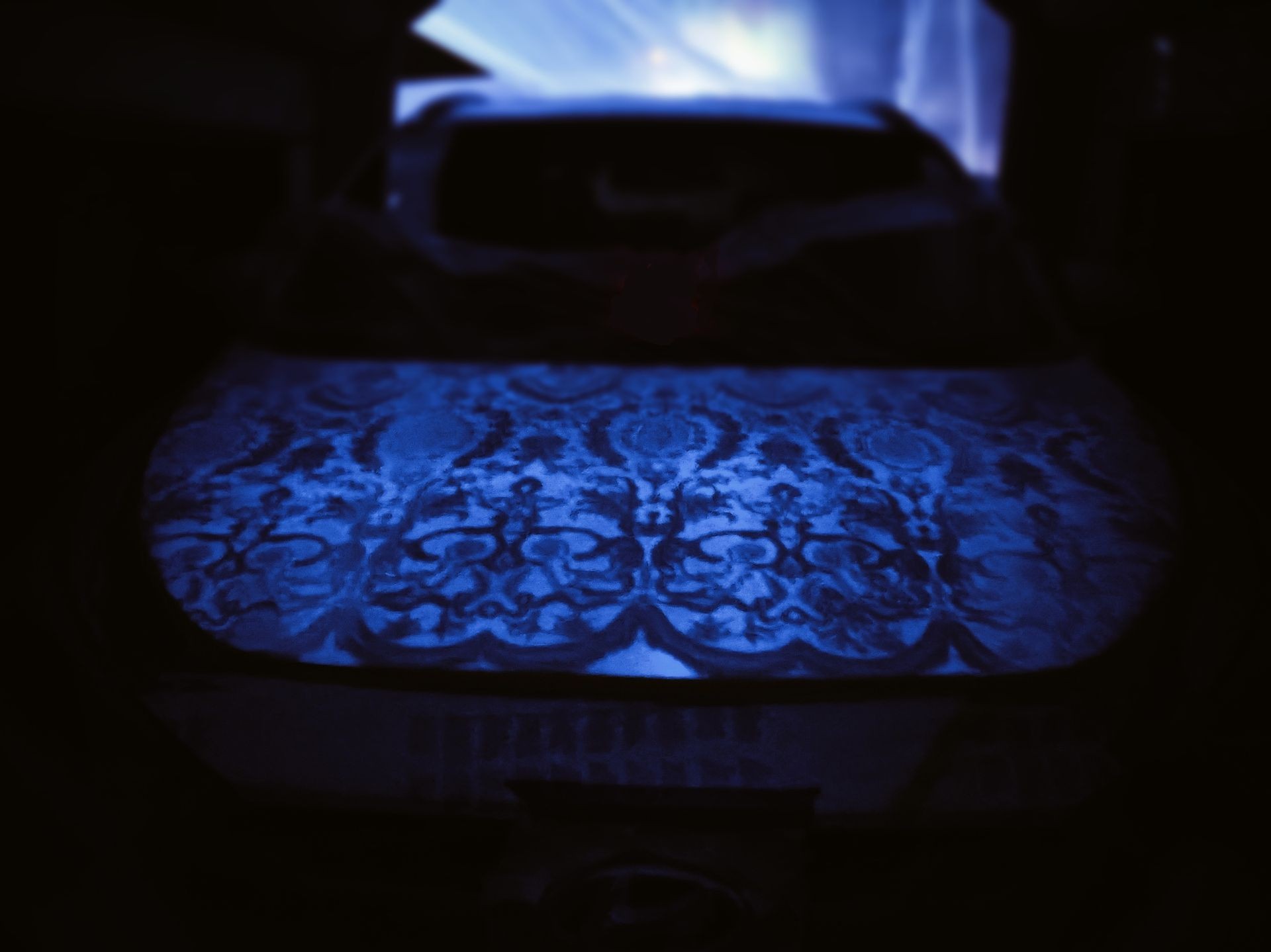 Car hood with glow-in-the-dark lace paint